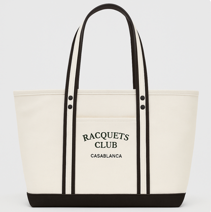Casablanca Racquets Club premium canvas tote bag with embroidered logo on a racquet sports court.